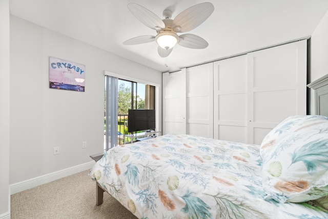 carpeted bedroom featuring ceiling fan, a closet, and access to exterior