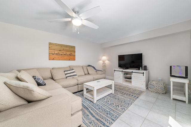 tiled living room featuring ceiling fan