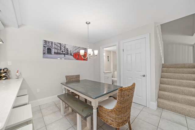 dining area featuring a notable chandelier and light tile patterned floors