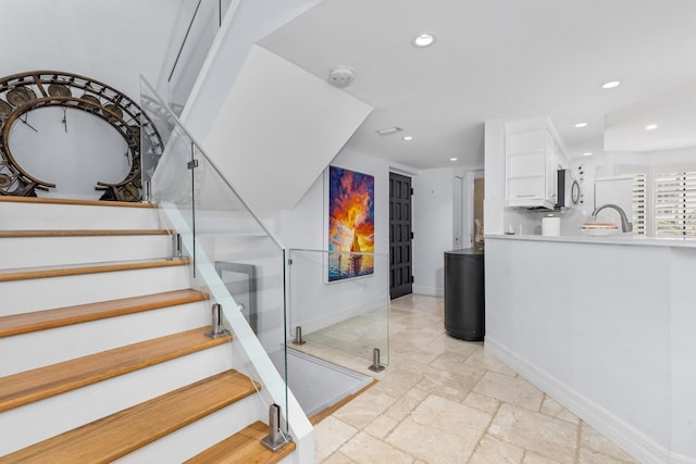 stairs featuring sink