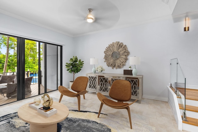 living room with ceiling fan and crown molding