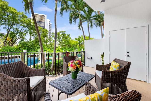 balcony featuring an outdoor hangout area and a water view