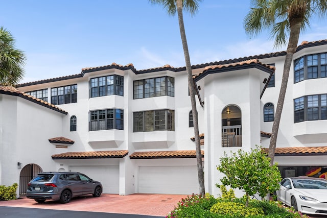 mediterranean / spanish-style home featuring a garage