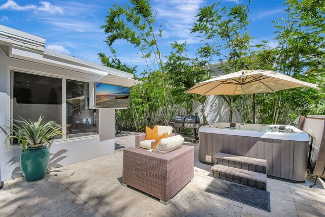 view of patio / terrace with a hot tub