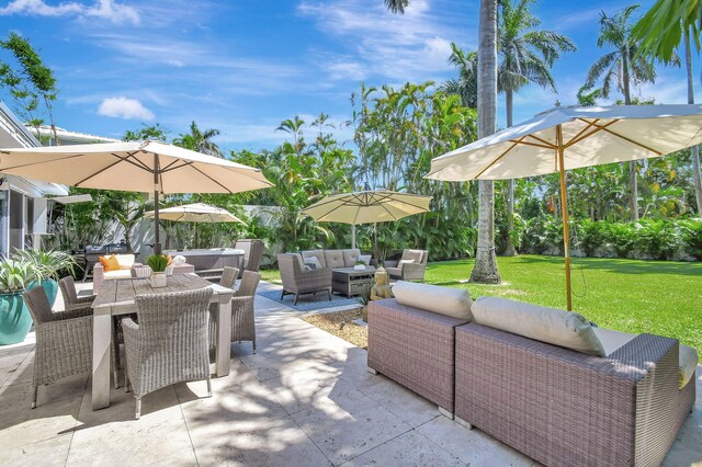 view of patio featuring outdoor dining area and an outdoor hangout area