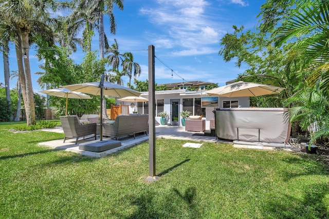 view of yard featuring a patio area and outdoor lounge area