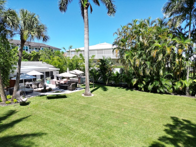 view of yard with a patio and an outdoor living space