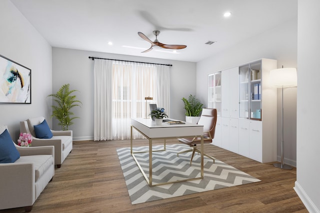 home office with ceiling fan and hardwood / wood-style flooring