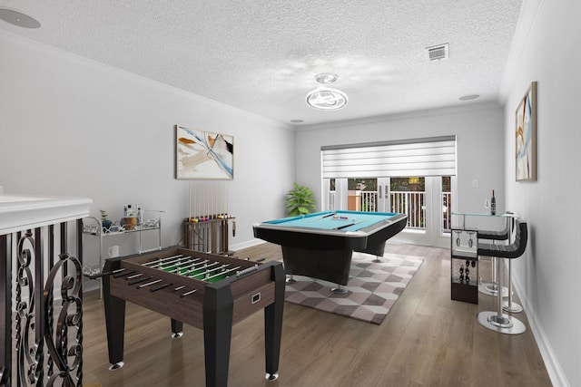 playroom featuring a textured ceiling, french doors, pool table, and hardwood / wood-style flooring