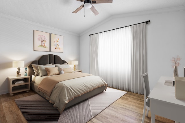 bedroom featuring ornamental molding, lofted ceiling, wood-type flooring, and ceiling fan