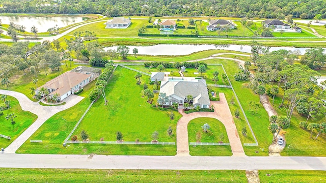 birds eye view of property featuring a water view