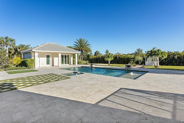 pool with an outbuilding, a storage structure, and a patio area