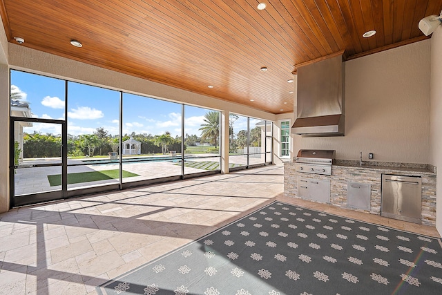 unfurnished sunroom with wooden ceiling