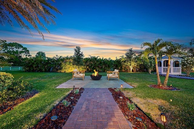 yard at dusk with a patio