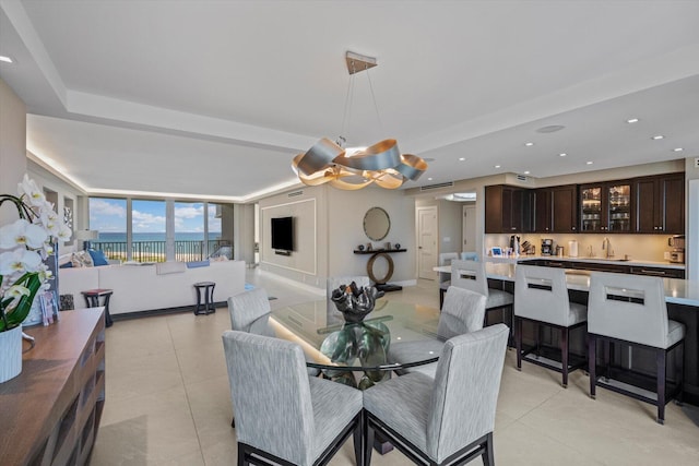 dining space with recessed lighting, baseboards, and light tile patterned floors