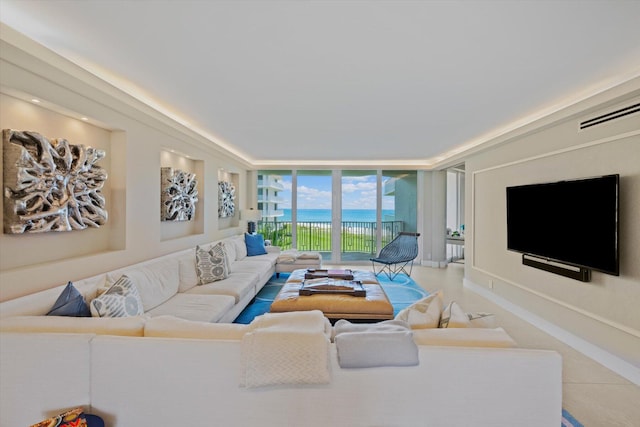 living area with floor to ceiling windows and baseboards