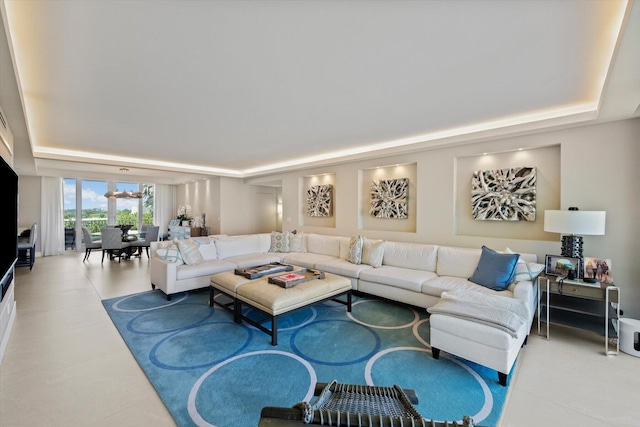 living room featuring a raised ceiling