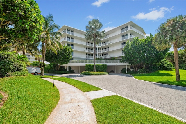 view of property with decorative driveway