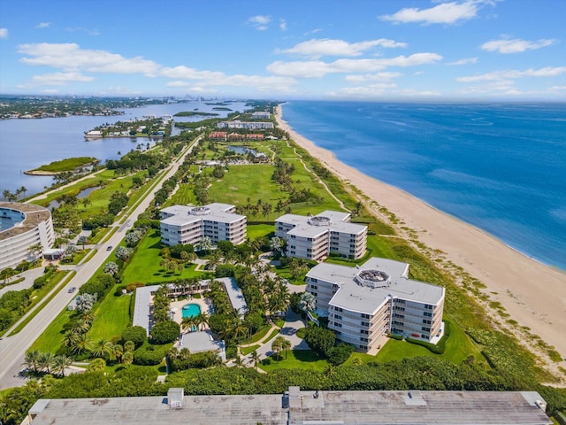 drone / aerial view featuring a water view and a beach view