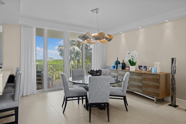 dining room featuring recessed lighting, light tile patterned flooring, baseboards, and an inviting chandelier