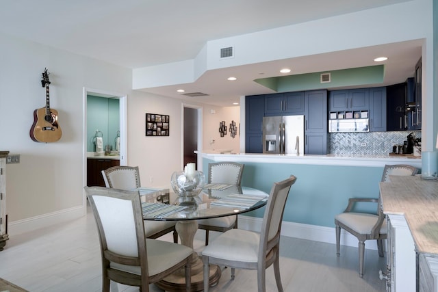 dining area with light hardwood / wood-style flooring