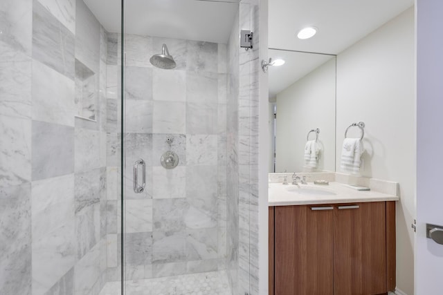 bathroom with vanity and shower with separate bathtub