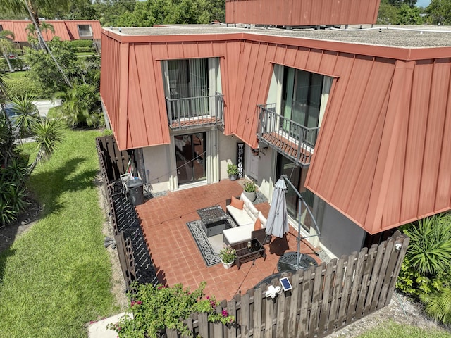 exterior space featuring a patio, a lawn, and fence