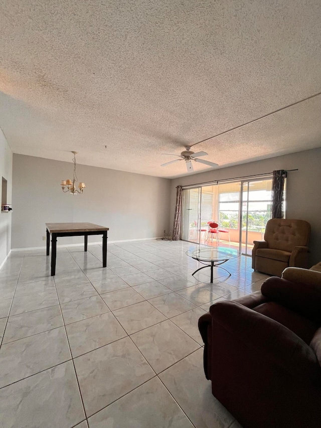 living room with a textured ceiling, light tile patterned flooring, and ceiling fan