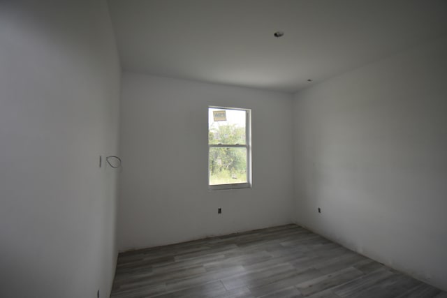 spare room featuring hardwood / wood-style flooring