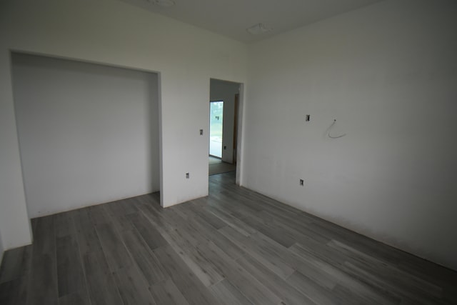 empty room featuring wood-type flooring