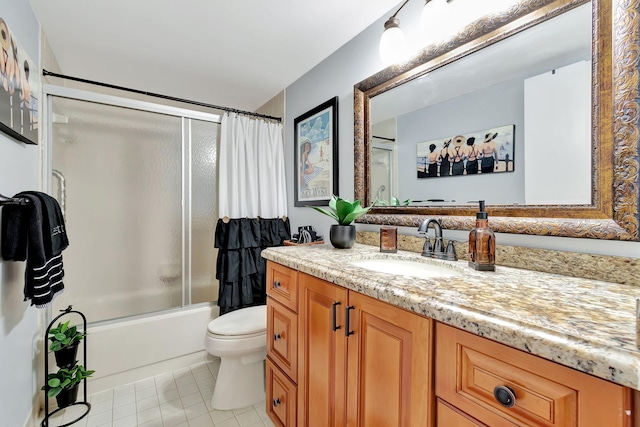 full bathroom featuring vanity, toilet, tile patterned floors, and enclosed tub / shower combo