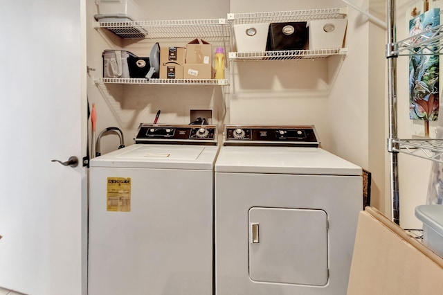 laundry room with washer and clothes dryer