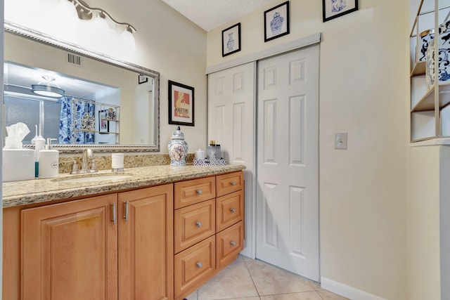 bathroom with vanity and tile patterned floors