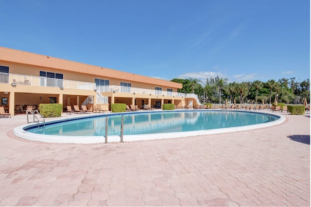 view of pool featuring a patio