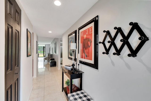 hall with light tile patterned floors