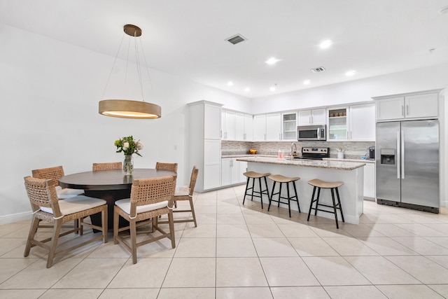 dining area with light tile patterned floors