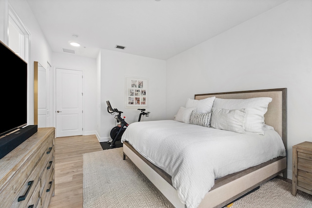 bedroom with light wood-type flooring