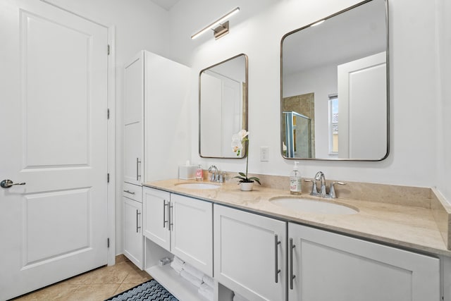 bathroom featuring vanity, tile patterned floors, and walk in shower