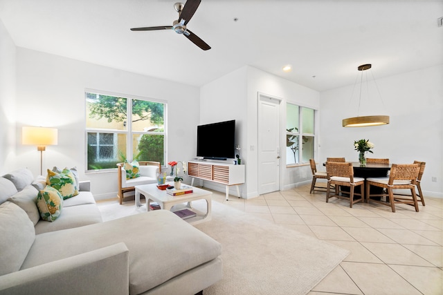 living room with ceiling fan and light tile patterned floors