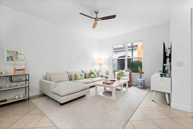 tiled living room featuring ceiling fan