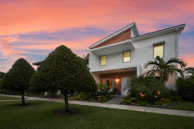 contemporary home featuring a lawn