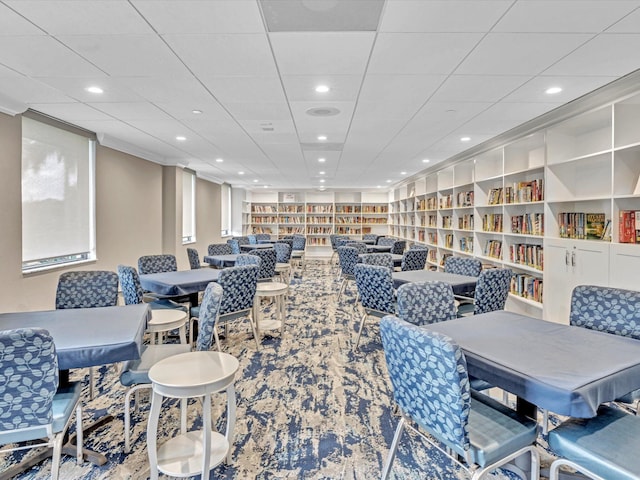 dining area with a paneled ceiling