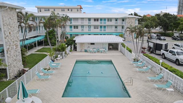 view of swimming pool with a patio area