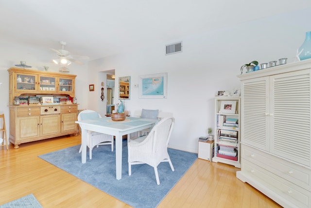 dining room featuring ceiling fan and light hardwood / wood-style floors