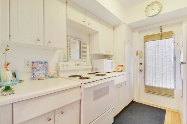 kitchen with plenty of natural light and white appliances