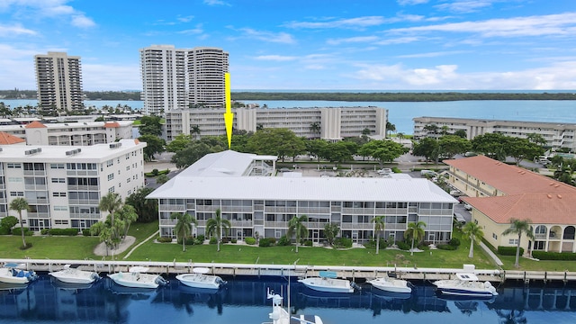 birds eye view of property with a water view