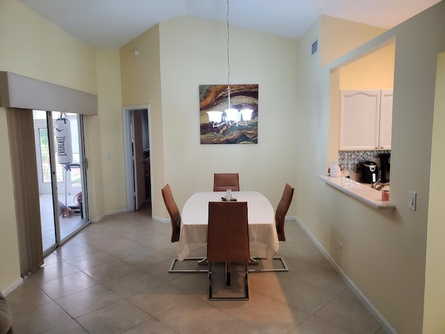 tiled dining area featuring high vaulted ceiling