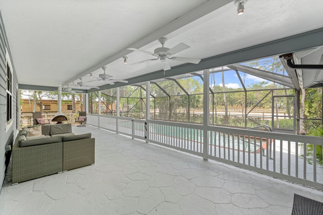 view of patio / terrace with glass enclosure and ceiling fan