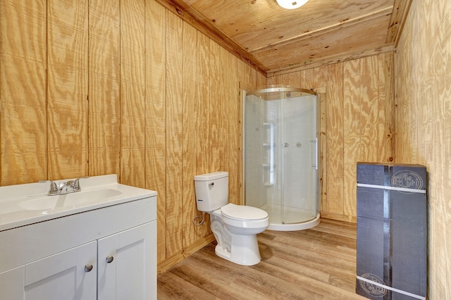 bathroom featuring hardwood / wood-style flooring, a shower with door, wooden ceiling, toilet, and vanity