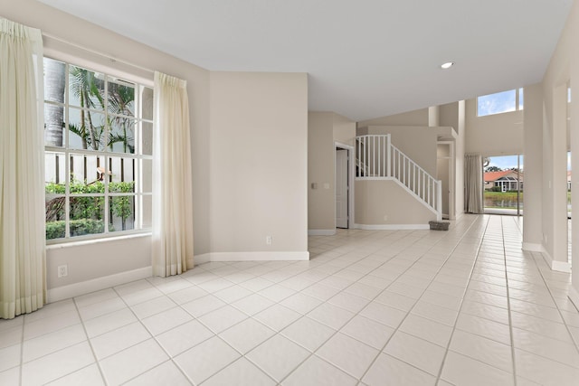 spare room with plenty of natural light and light tile patterned floors